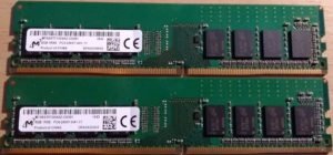Two sticks of Micron-branded DDR4, showing the 8 ICs with D9TBH written on them, and the empty space for a 9th.