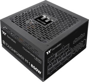 The new TT 80+ platinum power supply, the Toughpower PF1, seen here in the 850W model. The back reveals horizonal connectors for motherboard power crossing a good portion of the width of the PSU, and below them four 6-pin connectors for peripherals and five 8-pin connectors for CPU or GPU power cables.